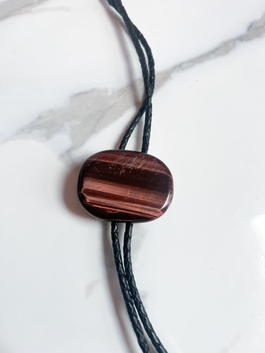 Red Tigers Eye Bolo Tie With Black Leather Cord and Silver Tone Tips