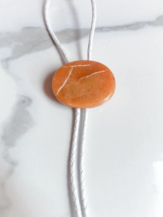 Red Aventurine Bolo Tie With White Leather Cord and Silver Tone Tips